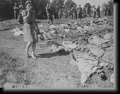 A German girl is overcome as she walks past the exhumed bodies... * A German girl is overcome as she walks past the exhumed bodies of some of the 800 slave workers murdered by SS guards near Namering, Germany. * 1403 x 1091 * (320KB)